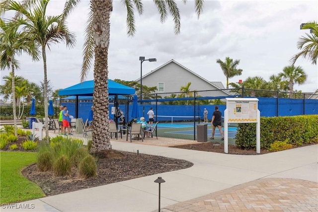 surrounding community with tennis court