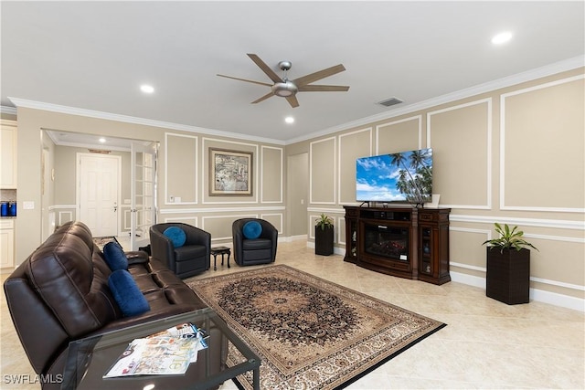 living room featuring crown molding, ceiling fan, and light tile patterned floors