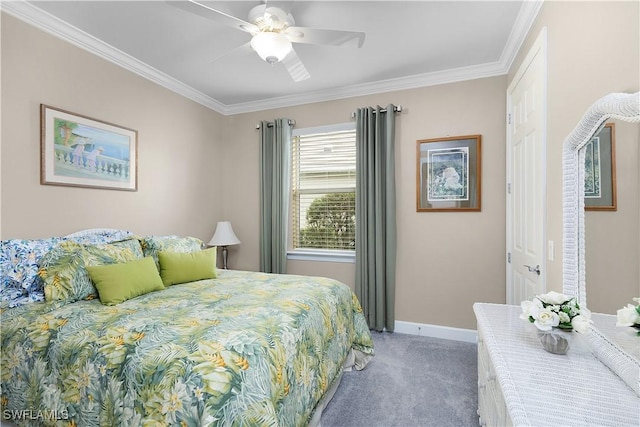 carpeted bedroom featuring ceiling fan and crown molding