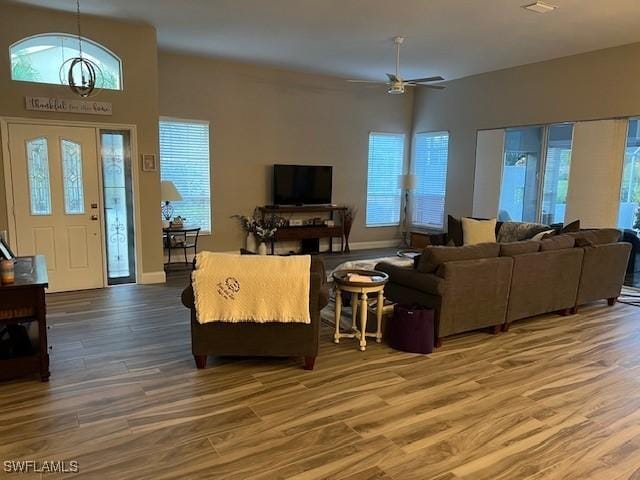 living room with ceiling fan and wood-type flooring