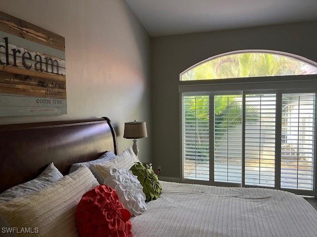 bedroom with lofted ceiling