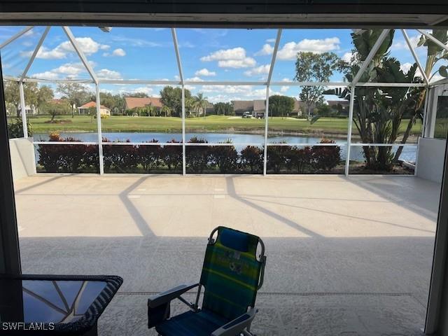 sunroom / solarium with a water view