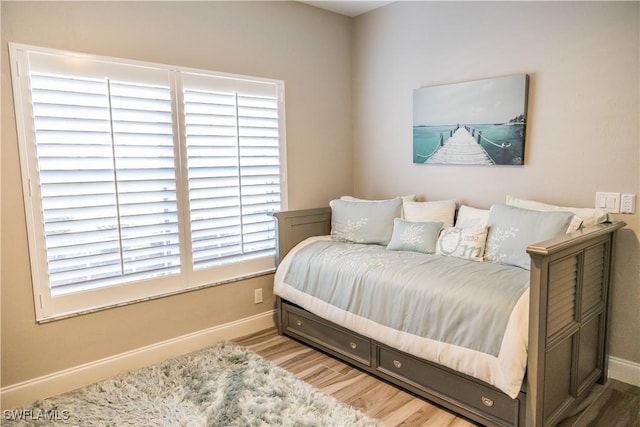 bedroom with light hardwood / wood-style floors