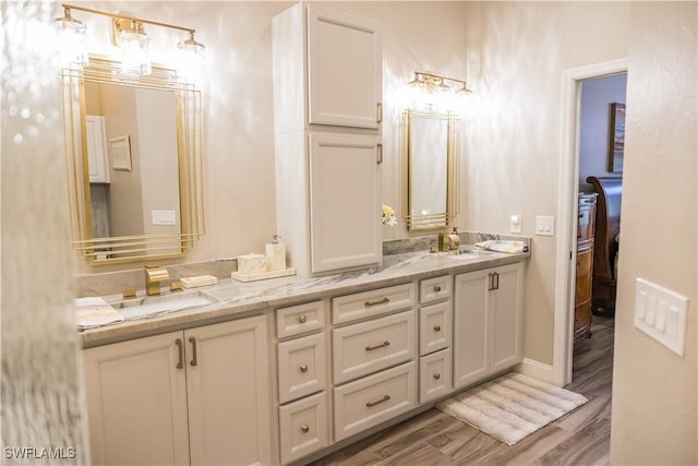 bathroom featuring vanity and hardwood / wood-style floors