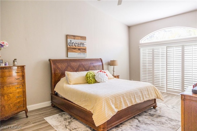 bedroom featuring light hardwood / wood-style flooring and ceiling fan