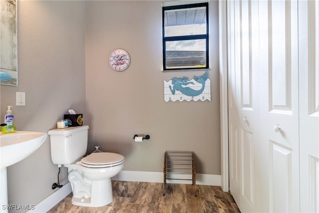 bathroom with toilet and sink