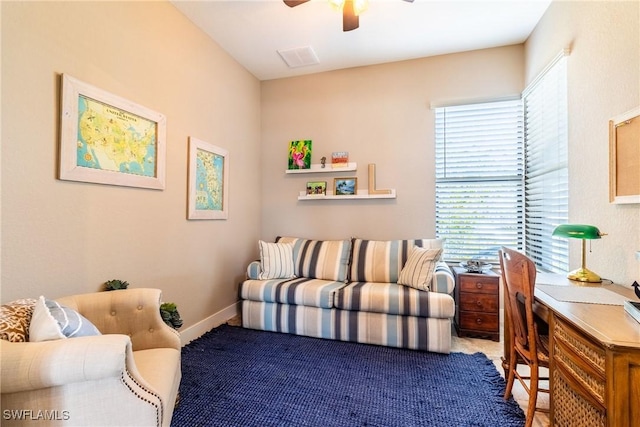 living room with carpet flooring and ceiling fan