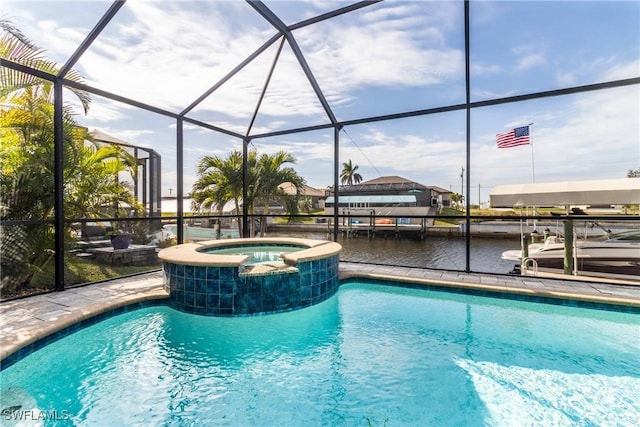 view of swimming pool with an in ground hot tub, a water view, and glass enclosure