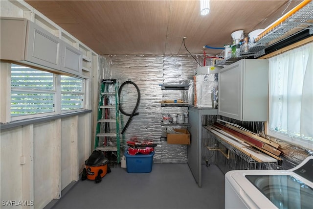 interior space featuring cabinets, washer / dryer, and wooden ceiling