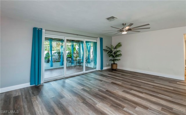 spare room with hardwood / wood-style flooring and ceiling fan