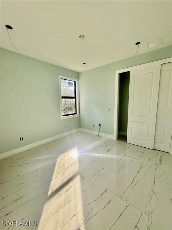 unfurnished bedroom featuring a closet