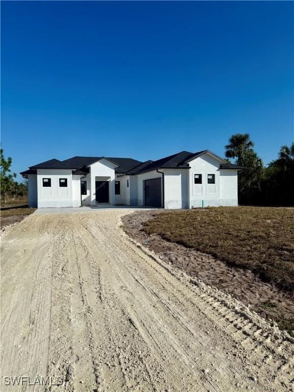 single story home featuring a garage