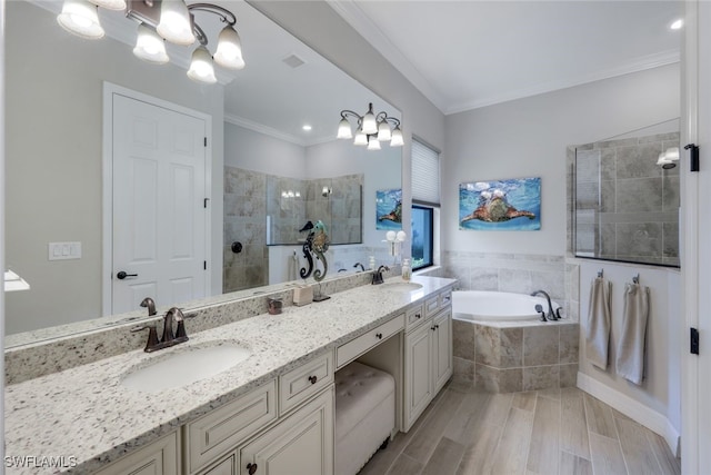 bathroom with vanity, crown molding, independent shower and bath, and an inviting chandelier