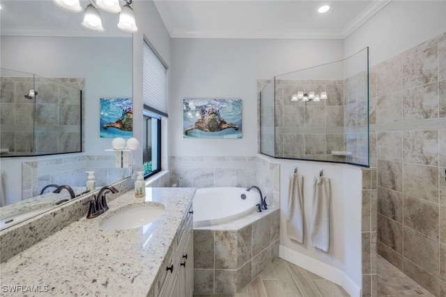 bathroom featuring a garden tub, vanity, walk in shower, and crown molding