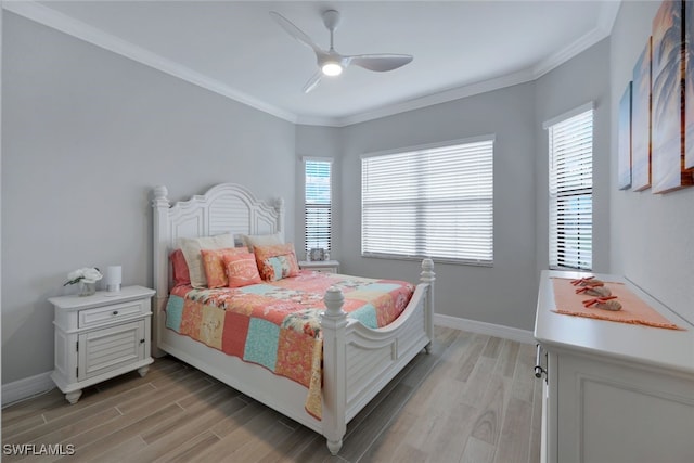 bedroom with ceiling fan, crown molding, and light wood-type flooring