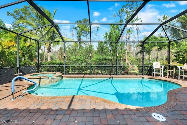 view of pool featuring an in ground hot tub, a patio, and glass enclosure