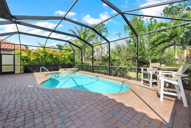 view of pool with glass enclosure, an in ground hot tub, and a patio