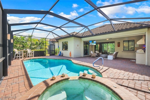 view of pool featuring a patio and a pool with connected hot tub