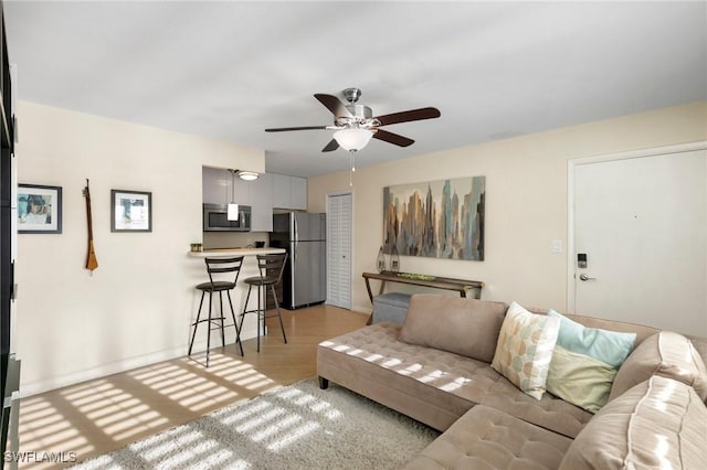 living room with ceiling fan