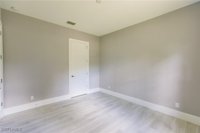 empty room with light wood-type flooring