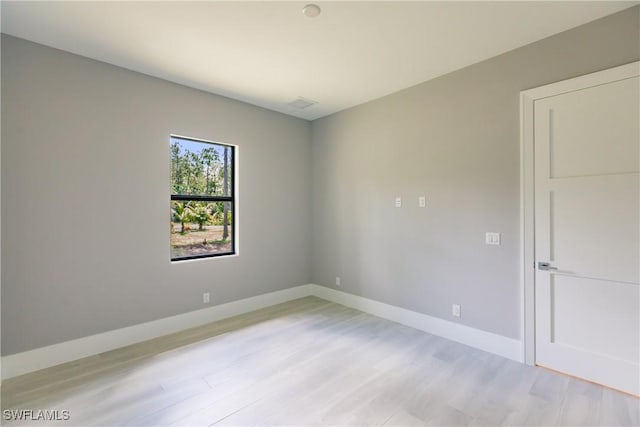 unfurnished room featuring light hardwood / wood-style floors