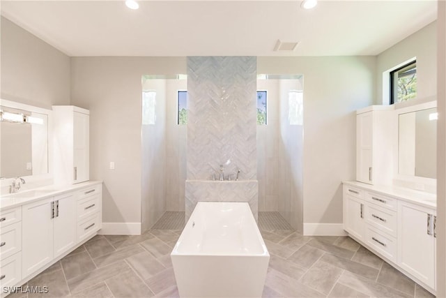 bathroom featuring vanity and plus walk in shower