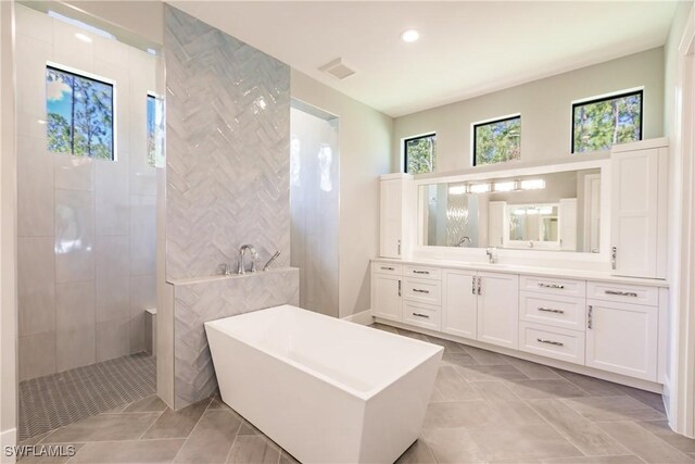 bathroom with vanity, tile patterned floors, and independent shower and bath