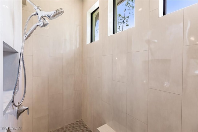 bathroom with tiled shower