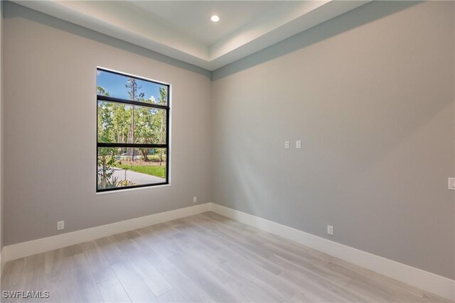 spare room with light wood-type flooring