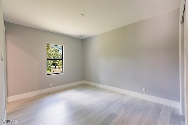 spare room with light hardwood / wood-style floors