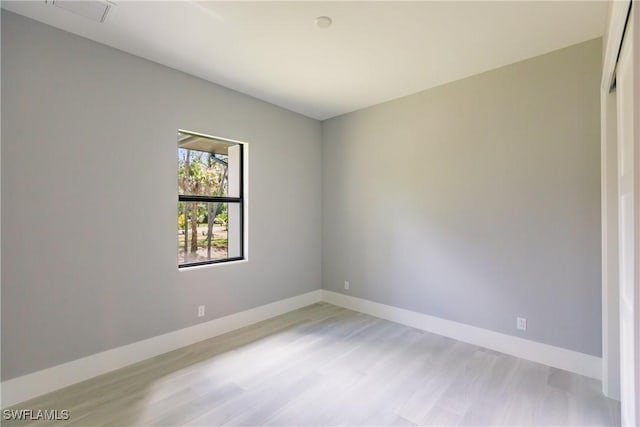 spare room with light hardwood / wood-style floors