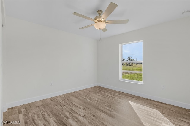 spare room with ceiling fan and light hardwood / wood-style floors