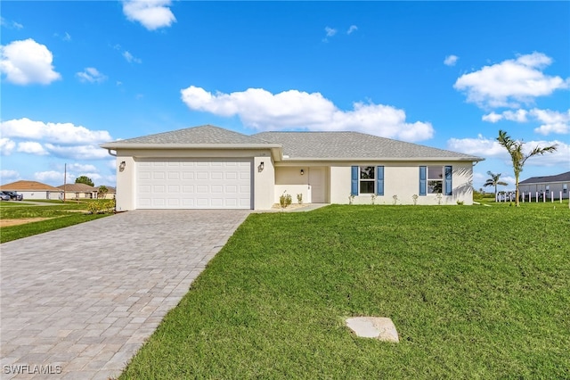 view of front facade with a front lawn and a garage