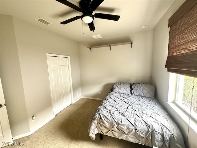 bedroom with carpet flooring, a closet, and ceiling fan