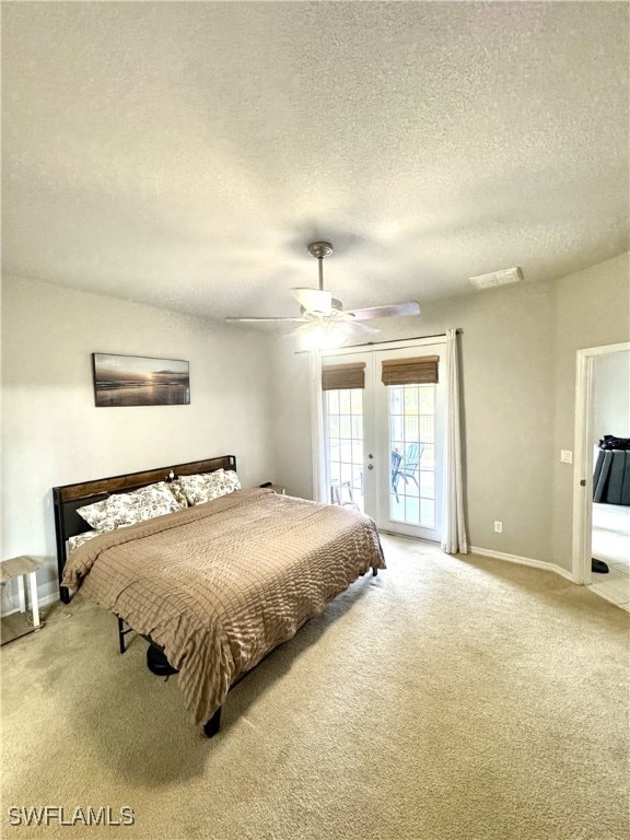 bedroom with access to outside, french doors, ceiling fan, a textured ceiling, and carpet floors