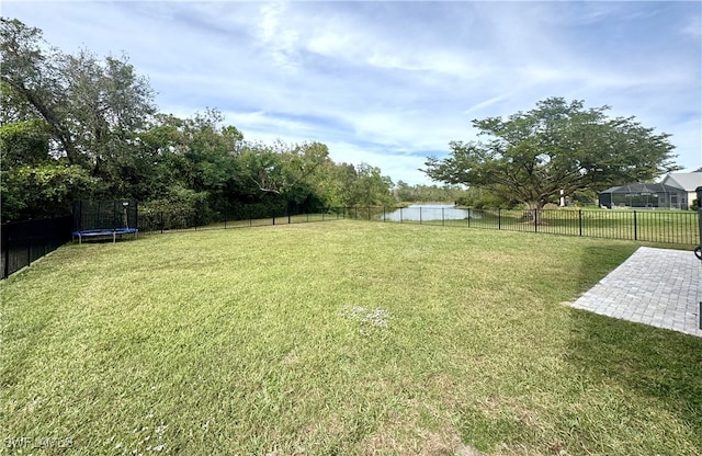 view of yard with a patio and a trampoline