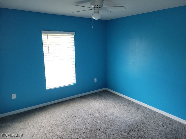 carpeted empty room with ceiling fan