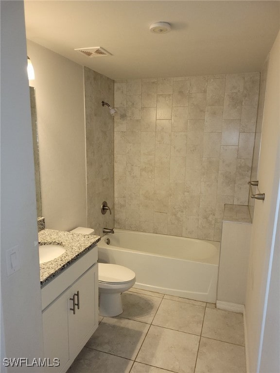 full bathroom with tile patterned floors, vanity, toilet, and tiled shower / bath combo