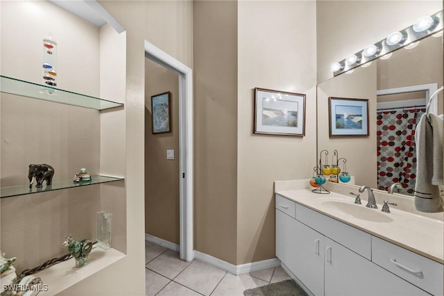 bathroom with tile patterned flooring and vanity