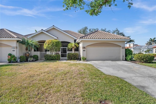 mediterranean / spanish house featuring a porch, a front yard, and a garage