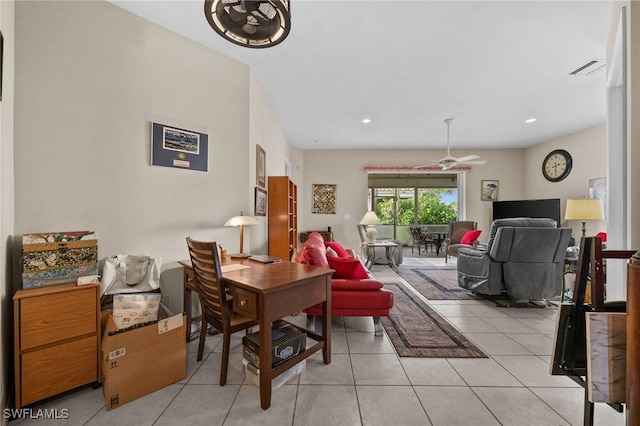 tiled dining space featuring ceiling fan