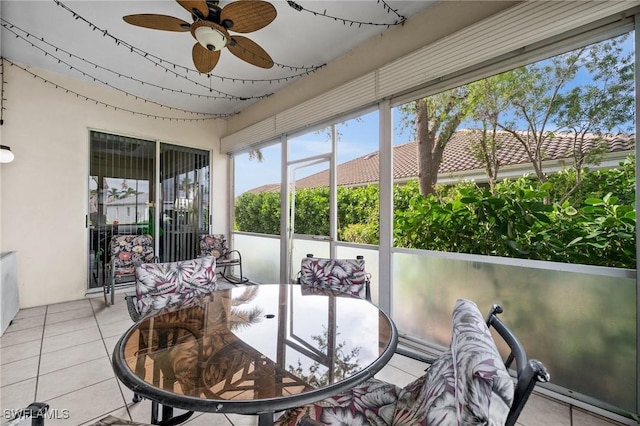 sunroom / solarium with ceiling fan