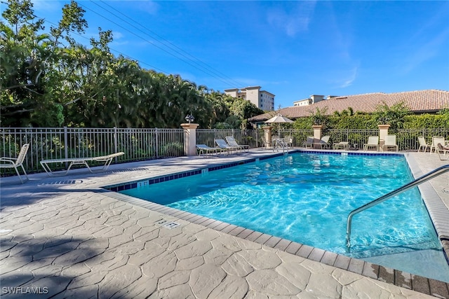 view of swimming pool featuring a patio area