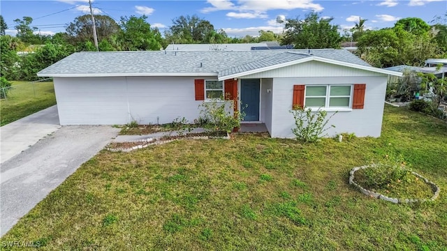 ranch-style home featuring a front yard