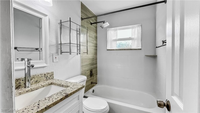 full bathroom with vanity, toilet, and tiled shower / bath combo