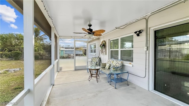 sunroom / solarium with ceiling fan