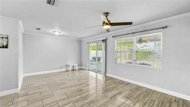 unfurnished room with ceiling fan and crown molding