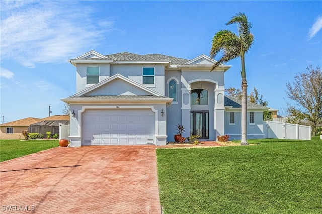 view of front facade with a garage and a front yard