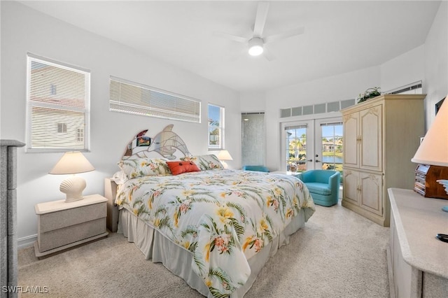 bedroom with access to outside, french doors, and ceiling fan