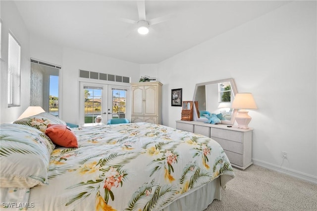 bedroom with light carpet, access to outside, french doors, and ceiling fan